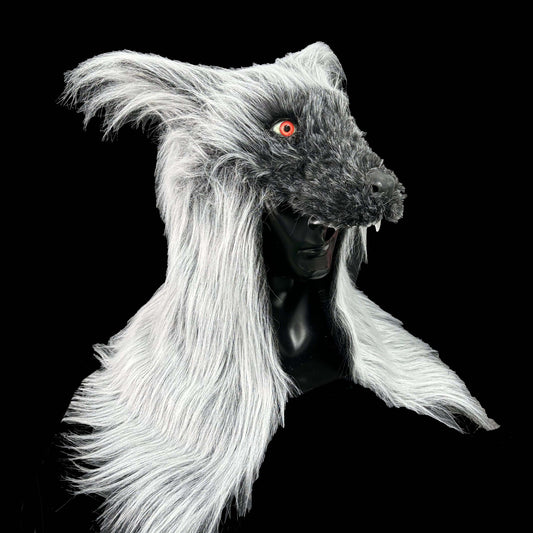 Wolf mask with white hair and red eyes on a black background