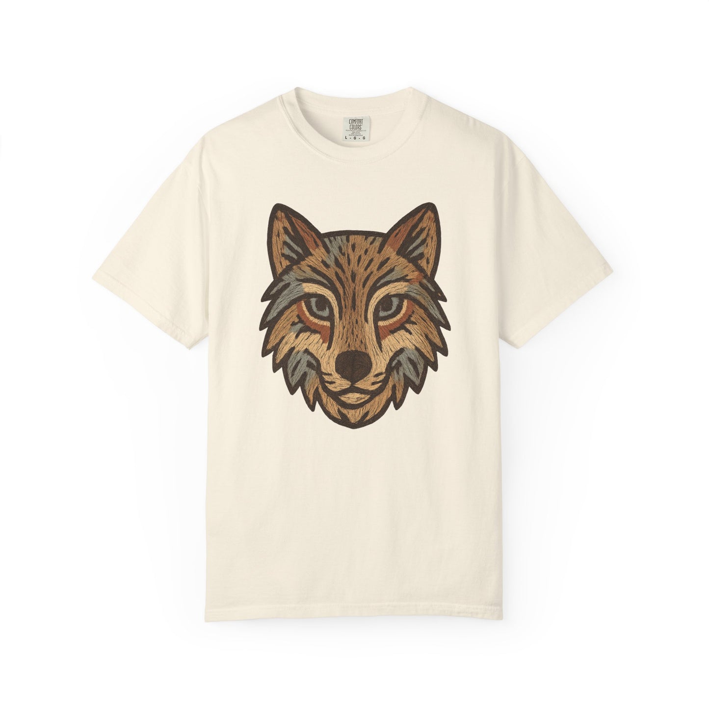Beige t-shirt with a graphic of a wolf's head on a white background