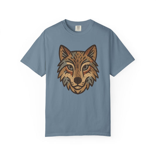 Blue t-shirt with a wolf graphic on a white background