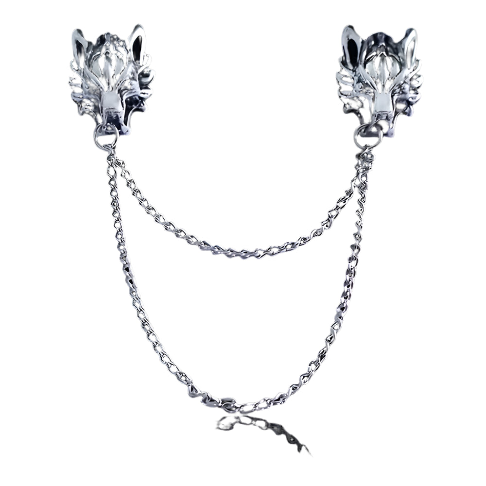 Pair of silver wolf head collar brooch pins with chains on a white background