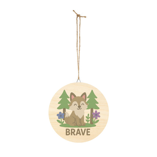 Round wooden ornament with a fox illustration and 'BRAVE' text, hanging on a white background.