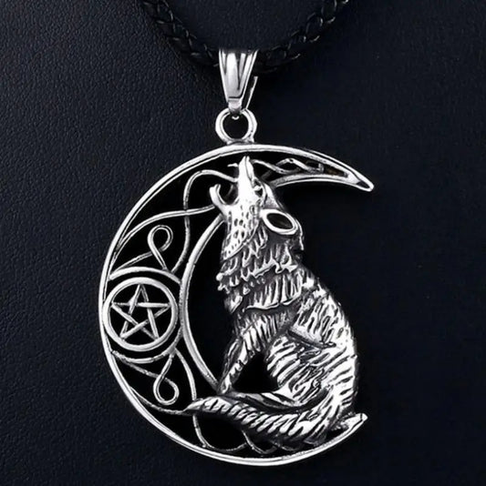 Silver wolf pendant with crescent moon and pentacle on a black background