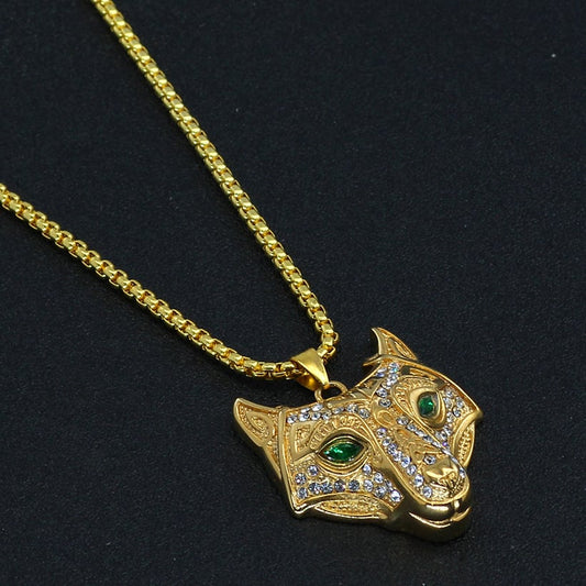 Gold necklace with a detailed pendant on a black background