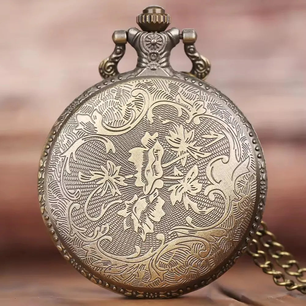 Decorative pocket watch with intricate designs on a blurred background