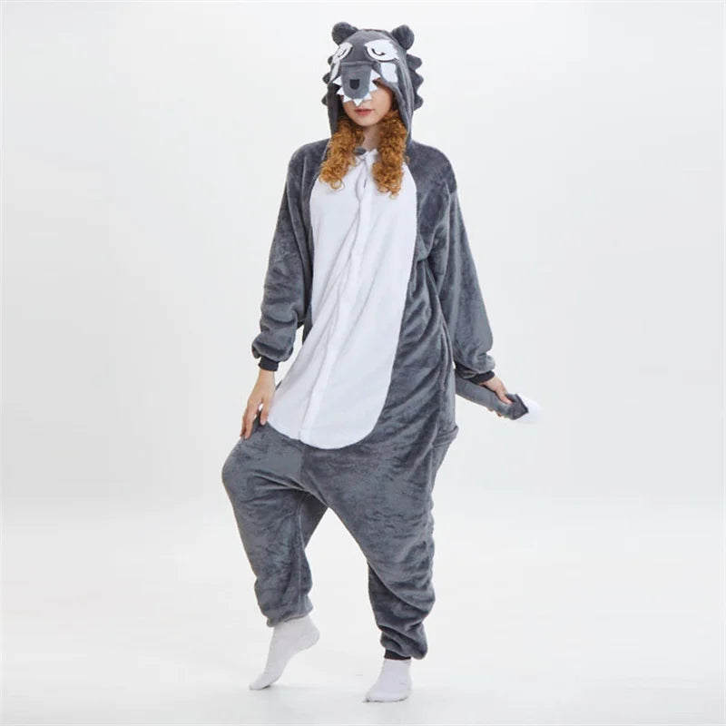 Person wearing a gray raccoon onesie on a white background