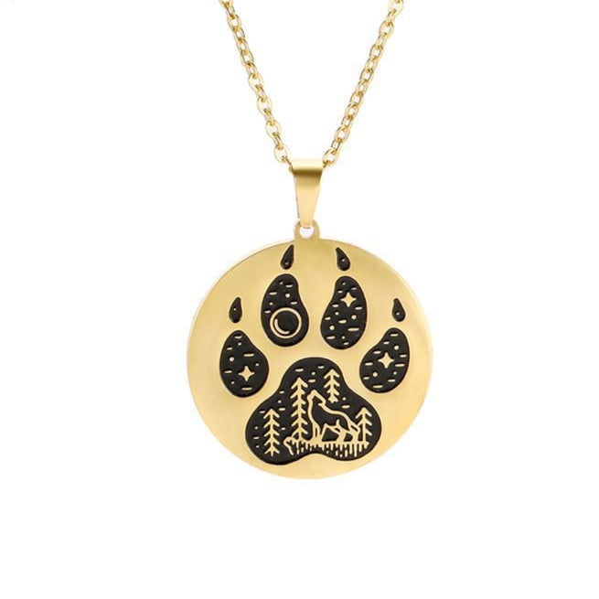 Gold necklace with a paw print pendant on a white background