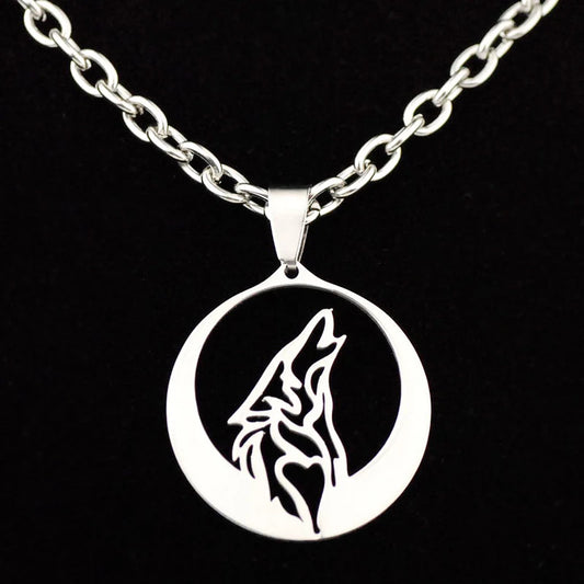 Silver necklace with a howling wolf pendant on a black background