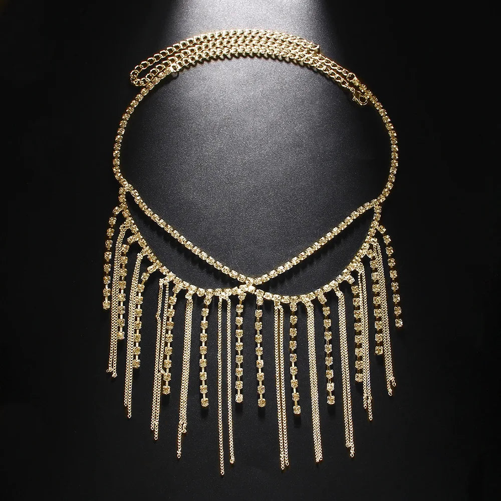 Gold fringe face mask on a black background