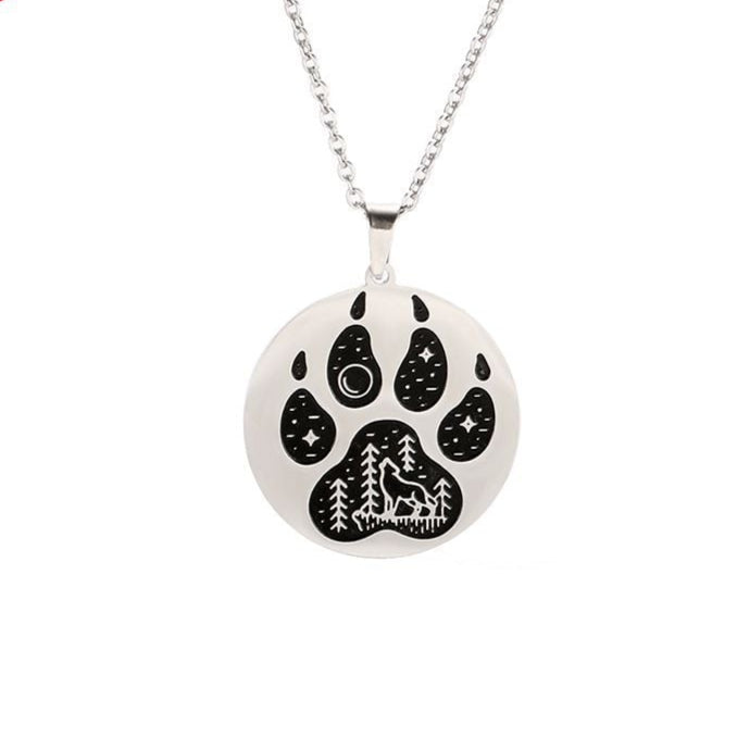 Necklace with a paw print pendant featuring a wolf design on a white background