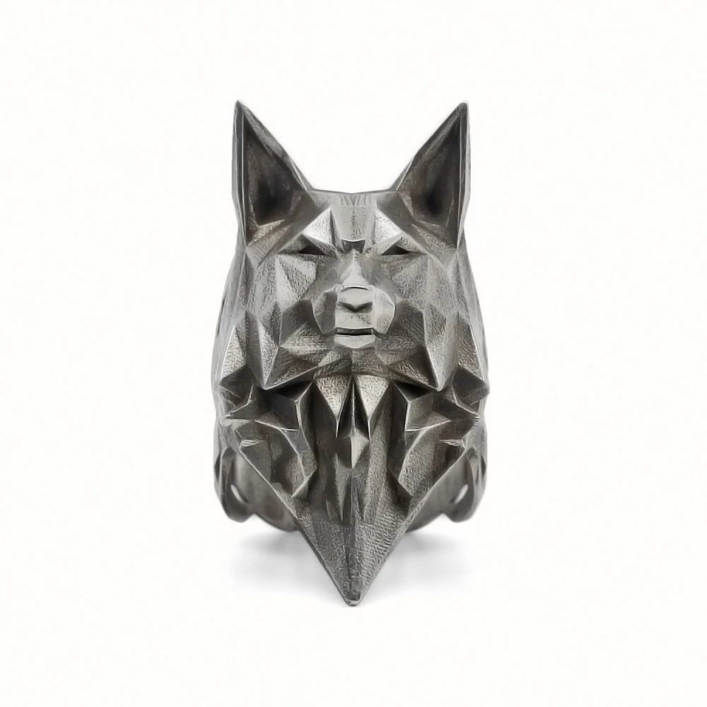 Geometric wolf head sculpture on a white background