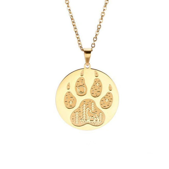 Gold necklace with a paw print pendant on a white background