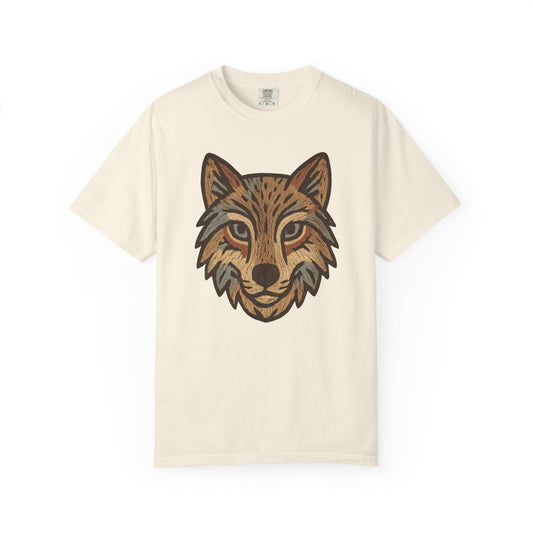 Beige t-shirt with a graphic of a wolf's head on a white background