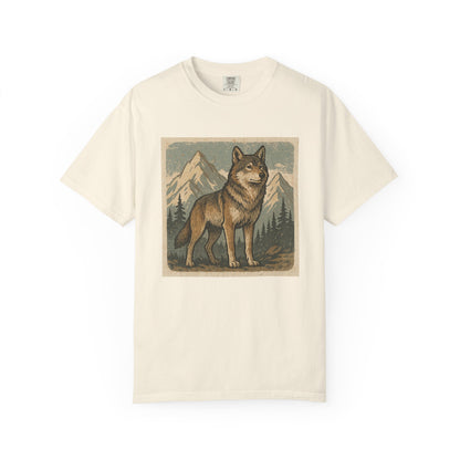 Beige t-shirt with a graphic of a wolf and mountains on a white background