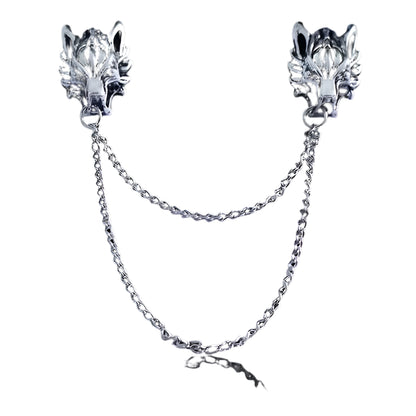 Pair of silver wolf head collar brooch pins with chains on a white background