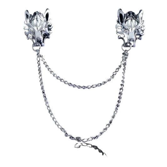 Pair of silver wolf head collar brooch pins with chains on a white background