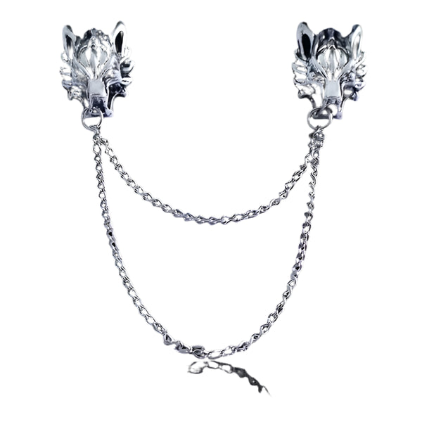 Pair of silver wolf head collar brooch pins with chains on a white background