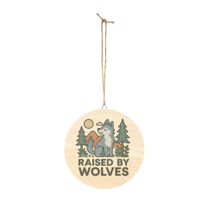 Decorative hanging sign with a wolf design and 'Raised by Wolves' text on a white background.