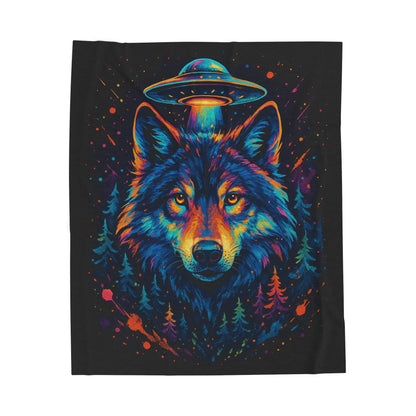 Colorful wolf design with a UFO above its head on a black blanket