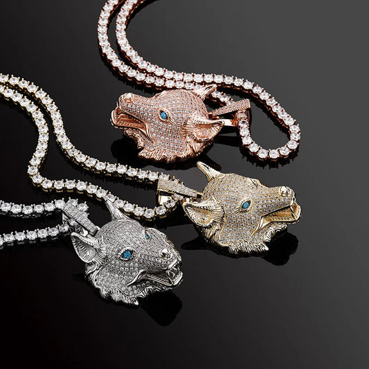 Three wolf head pendants on chains against a black background
