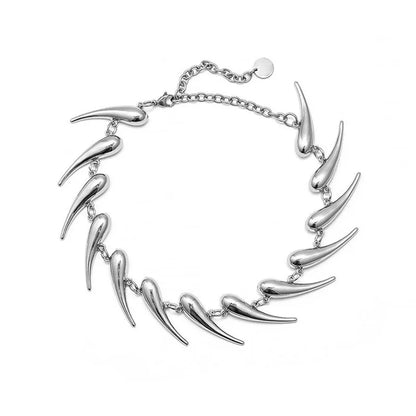 Silver wolf tooth choker necklace with unique design on a white background