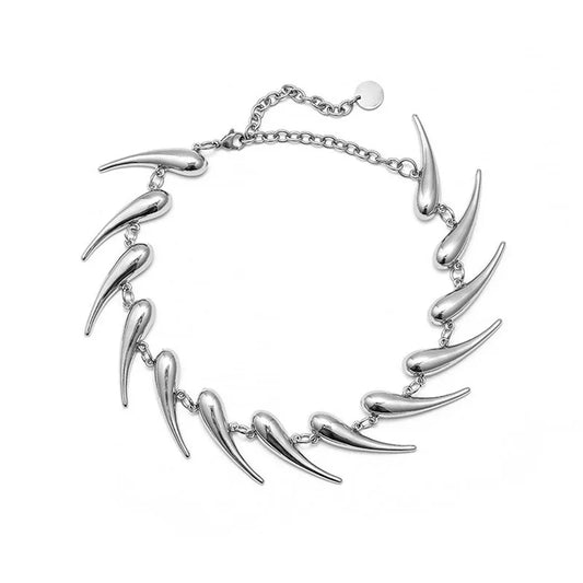 Silver wolf tooth choker necklace with unique design on a white background