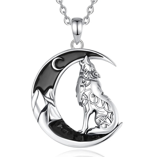 Silver necklace with a wolf and crescent moon design on a white background