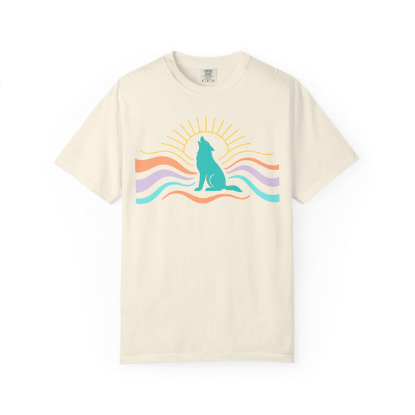 Beige t-shirt with a colorful graphic of a wolf howling at the sun on a white background