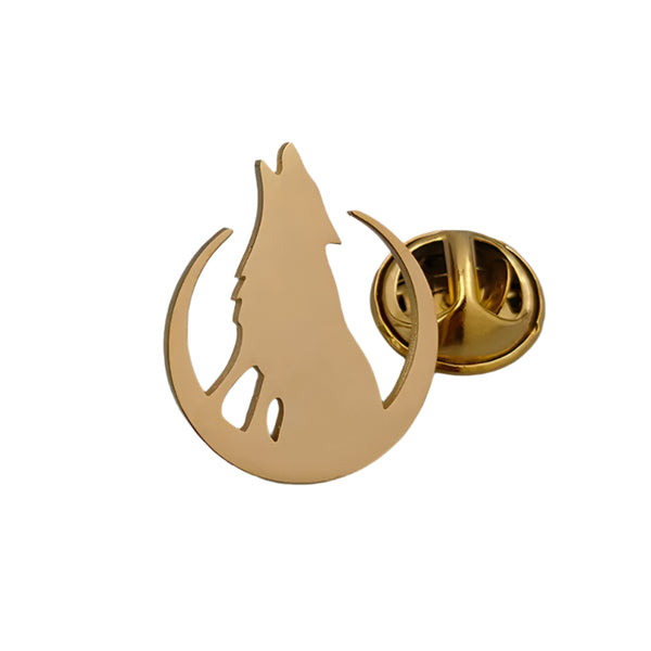 Gold-colored pin with a wolf design on a gray surface