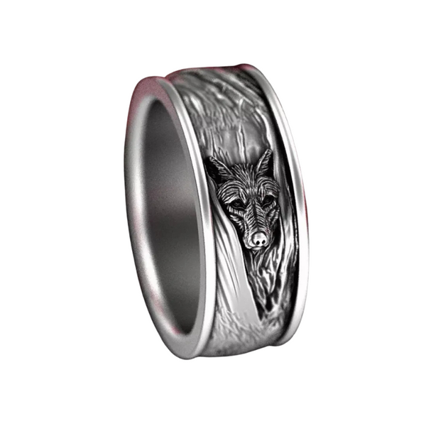 Silver ring with wolf design on a white background