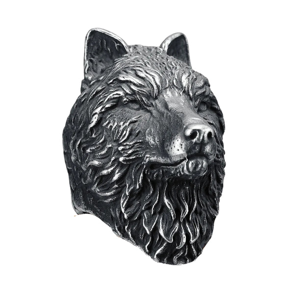 Metallic wolf head ring on a white background