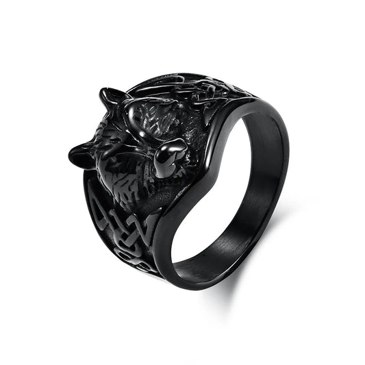 Black metal ring with wolf head design on a white background
