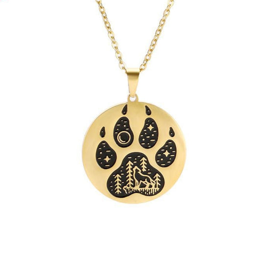 Gold necklace with a paw print pendant on a white background