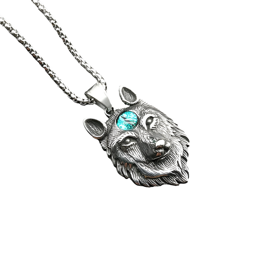 Silver wolf head necklace with a turquoise gemstone on a white background