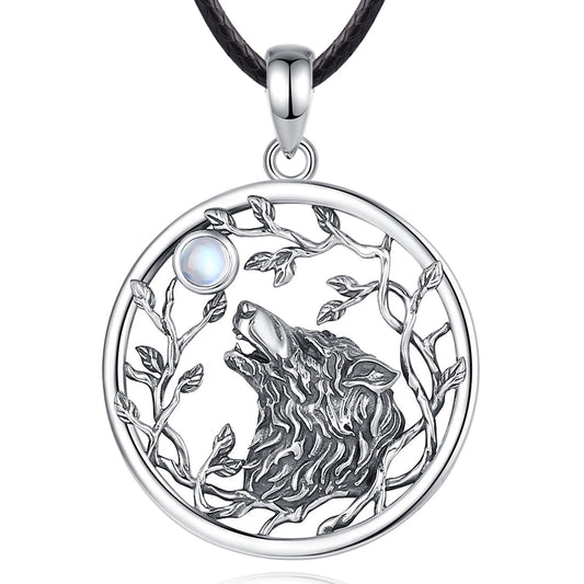 Silver pendant with wolf design and moonstone on a white background