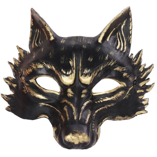 Black and gold wolf mask on a white background