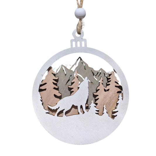 Wolf ornament with mountains against a white background.